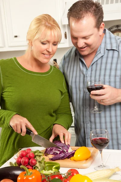 Couple Drinking Wine in the Kitchen Stock Photo
