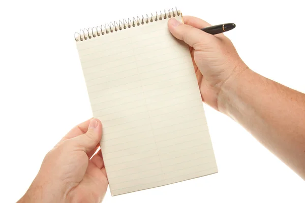 Мужские руки держат ручку и блокнот бумаги Стоковая Картинка