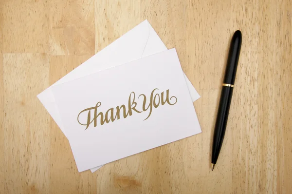 Thank You Note Card and Pen on Wood Stock Image