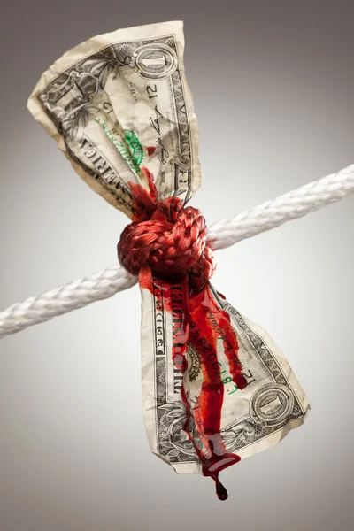 Wrinkled Dollar Tied Up and Bleeding Stock Picture