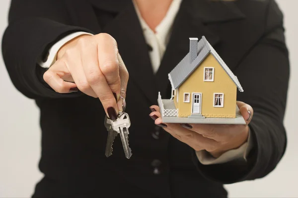House and Keys in Female Hands Royalty Free Stock Photos
