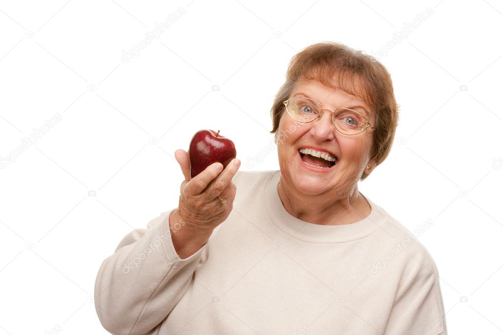 Attractive Senior Woman with Apple Isolated on a