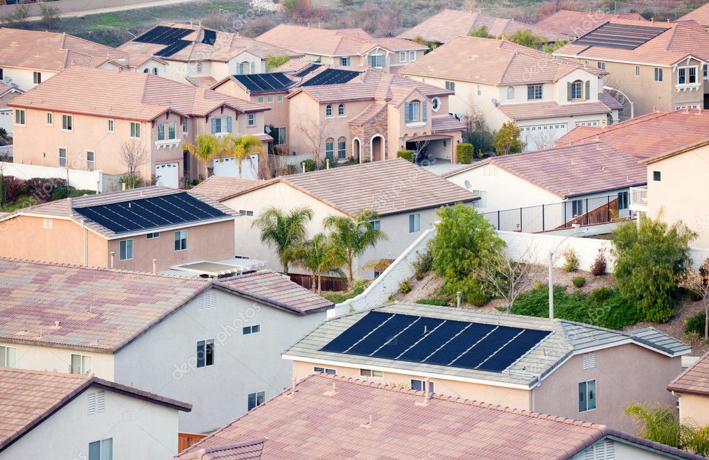 stock photo aerial shot of neighborhood with solar panels