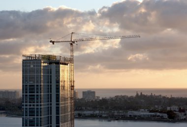 Silhouette of Crane and Building clipart