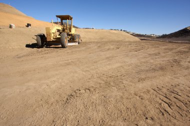 Tractor at a Dirt Construction Site clipart