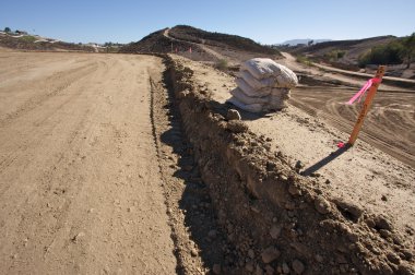 Sandbags & Marker Sticks at Construction Site clipart