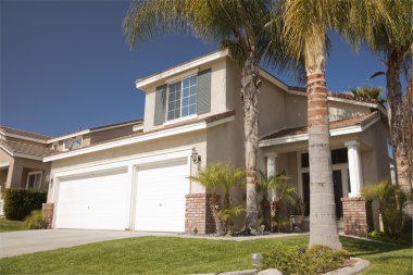 New Residential Home with Palm Trees clipart