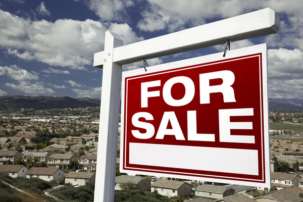 For Sale Real Estate Sign Over Homes — Stock Photo, Image