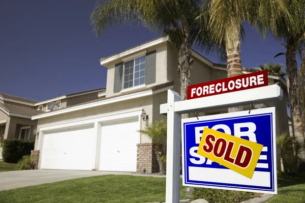 Blue Sold Foreclosure Sign and House — Stock Photo, Image