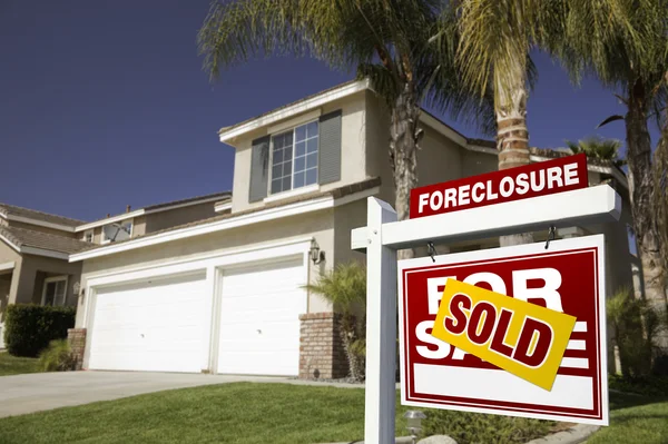 Red Sold Foreclosure Sign and House — Stock Photo, Image