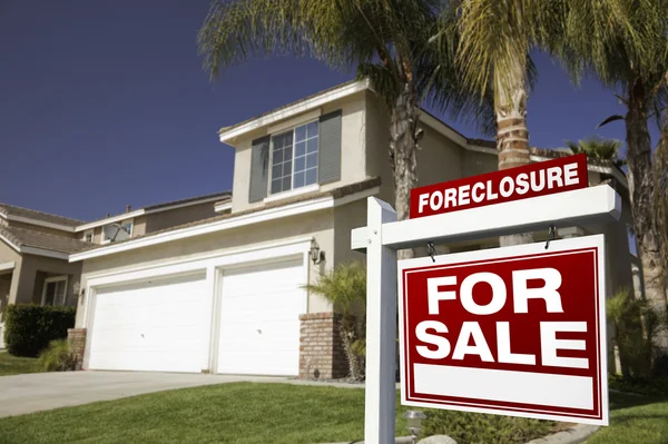 Red Foreclosure Sign and Home — Stock Photo, Image