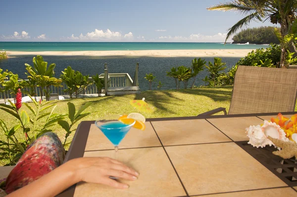 Woman with Tropical Drinks on Lanai — Stock Photo, Image