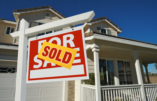 Sold Home For Sale Sign and New House