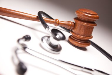 Gavel and Stethoscope Abstract clipart