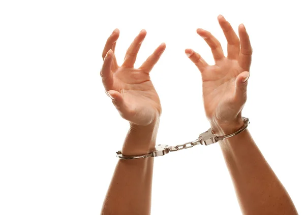 В наручниках леді відчайдушно піднімає руки — стокове фото