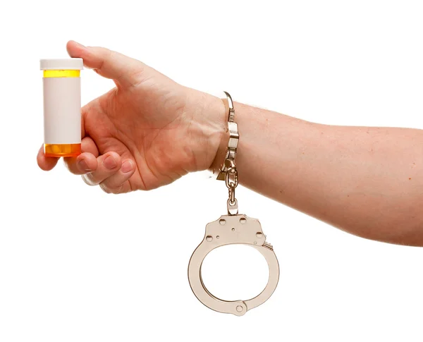 Homem algemado detém garrafa de prescrição — Fotografia de Stock