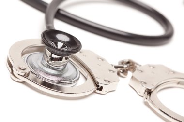 Stethoscope and Handcuffs Isolated clipart