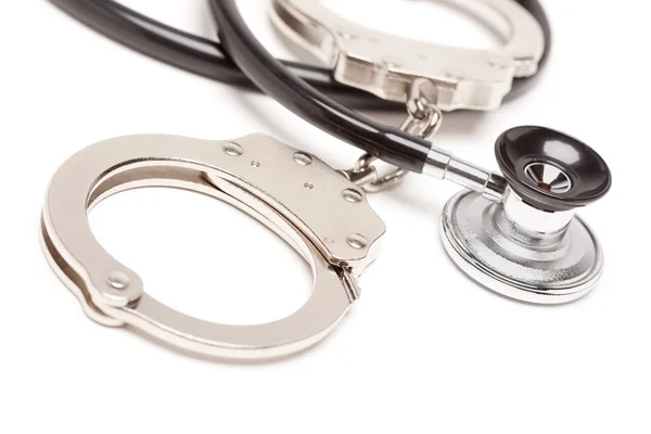 Stethoscope and Handcuffs Isolated — Stock Photo, Image