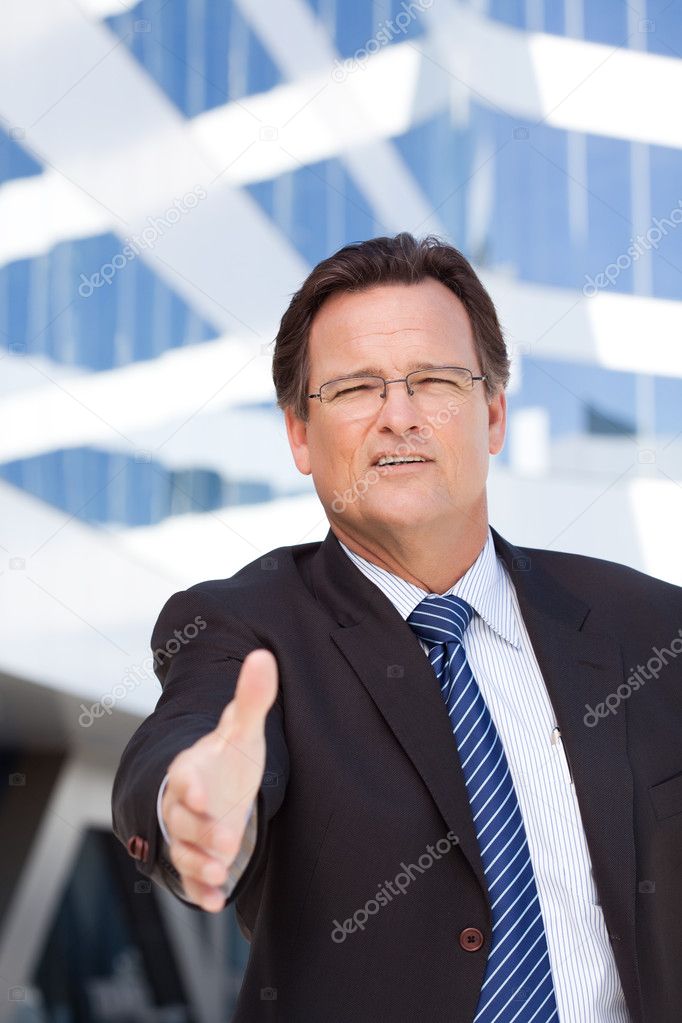 Smiling Businessman Ready to Shake Hands