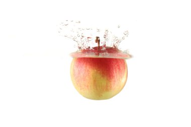 Red apple falling into water clipart