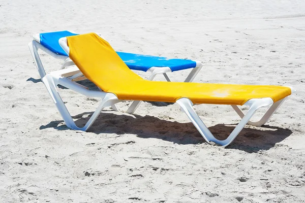 Beach chairs in a deserted beach — Stock Photo, Image