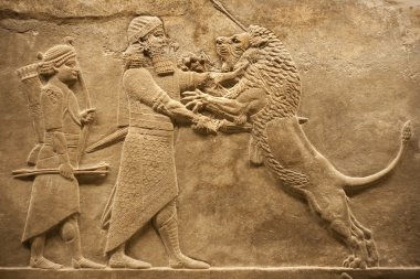 Assirian warrior hunting lions clipart