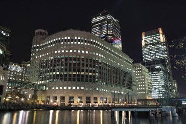 Canary Wharf skyscrapers in London at night clipart