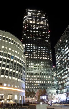 Canary Wharf skyscrapers in London at night clipart