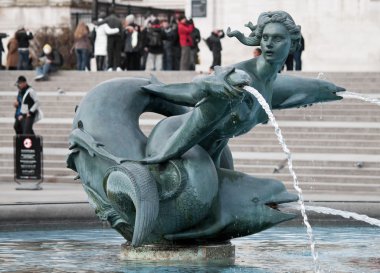 A fountain in Trafalgar Square, London clipart