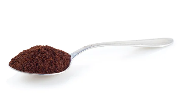 Shiny silver spoon filled with coffee — Stock Photo, Image