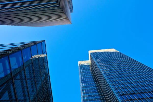 Blue toned skyscrapers with a clear sky — Stock Photo, Image