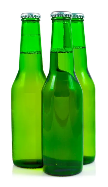 Üç yeşil bira şişeleri — Stok fotoğraf