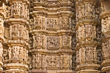 Kamasutra scene on the wall of a Temple in Khaju clipart