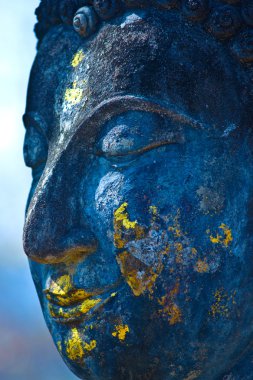 Buddha face, Sukhothai, Thailand. Blue. clipart