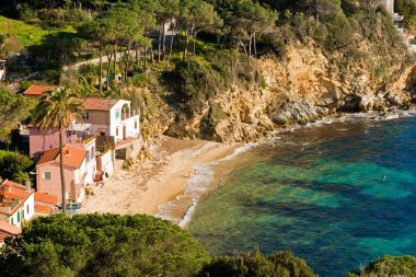 Forno Beach before sunset, Italy. clipart