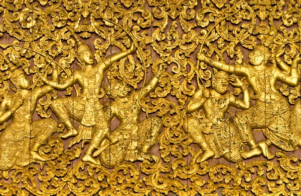 stock image The ramayana epic carved on a wood door inside a