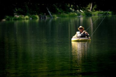 Man Fishing in Lake clipart