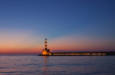 Hania lighthouse at dusk clipart