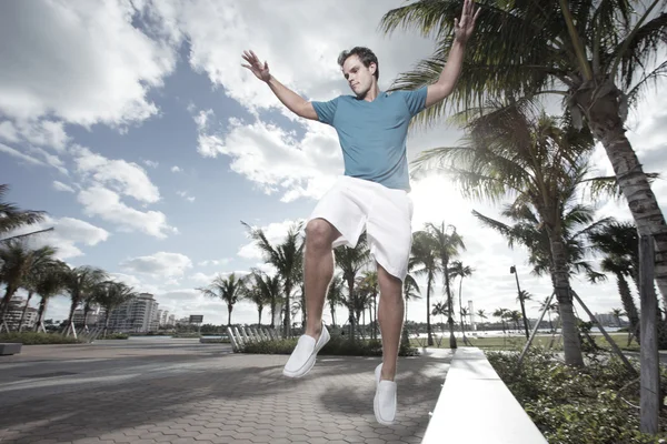 Man jumping from a bench — Stock Photo, Image