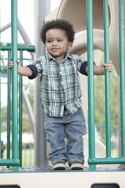 Criança bonita em um playground — Fotografia de Stock