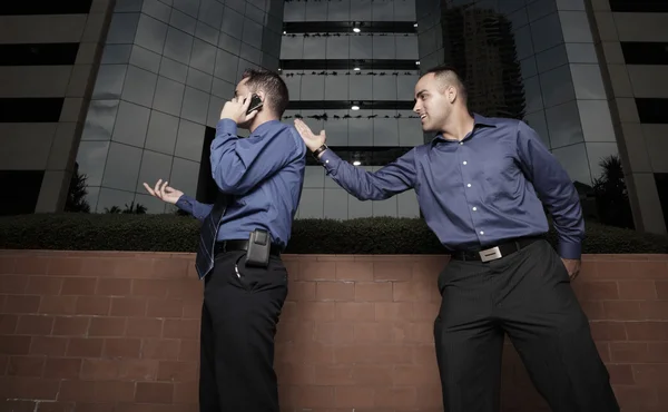 Businessman karate chopping another businessman on the back — Stock Photo, Image