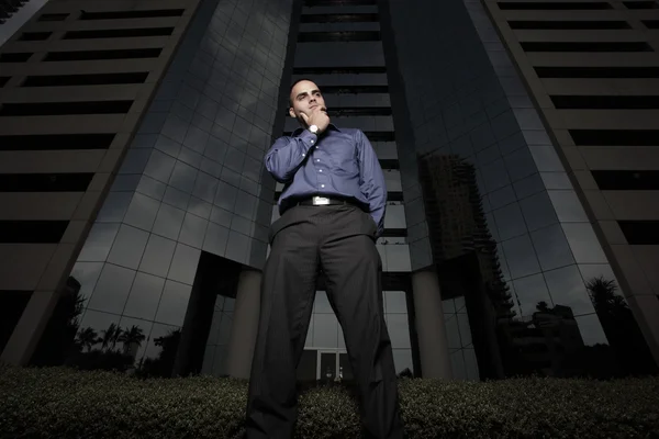 Businessman by a building — Stock Photo, Image
