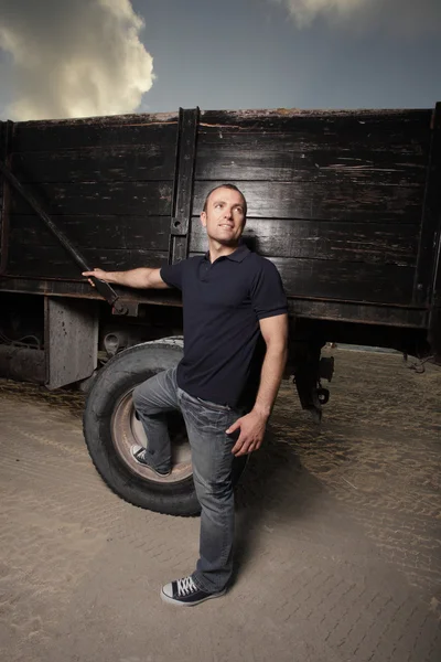 Man posing by a truck — Stock Photo, Image