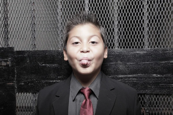 Jovem homem de negócios salientando a língua — Fotografia de Stock