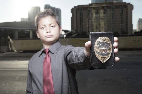 Child holding a badge — Stock Photo, Image