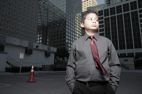 Child businessman in the city — Stock Photo, Image