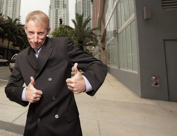 Businessman showing two thumbsup — Stock Photo, Image