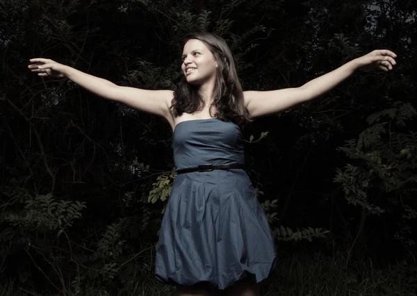 Young teenager with arms outstretched — Stock Photo, Image