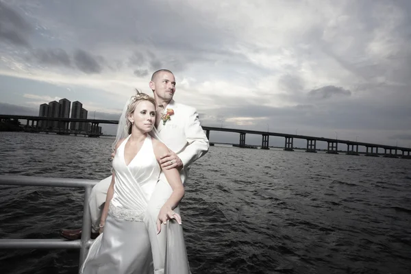 Young newlywed couple by the bay Royalty Free Stock Images
