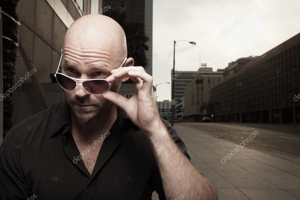 Man removing his sunglasses